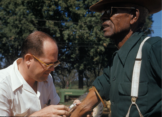Tuskegee syphilis study doctor injects a subject with a placebo. Centers for Disease Control