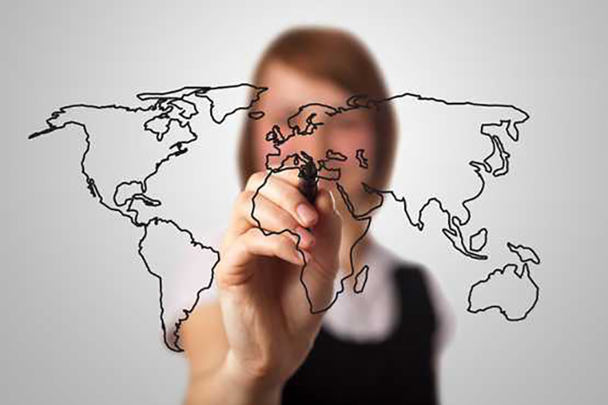 woman_drawing_map_onto_glass